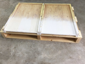 The top insides of bottom boards don't require paint. 