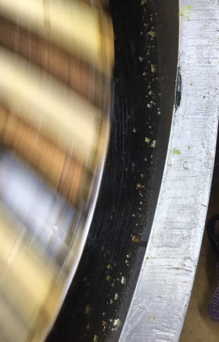 Step 4: Extracting
When the cappings are opened, the frames are put into a honey extractor. The extractor spins the frames and the centrifugal force pushes the honey out of the comb. The honey is collected at the bottom of the extractor, filtered, and pumped into a holding tank.