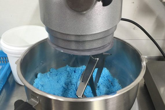 4. Coloring
If it's a two colored bath bomb, we divide the product in half and color the batches seperately.